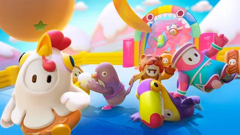 Fall Guys のキービジュアル。ニワトリやペンギンの着ぐるみを着たカラフルな豆人間たちが、ふわふわのステージではしゃいでいる
