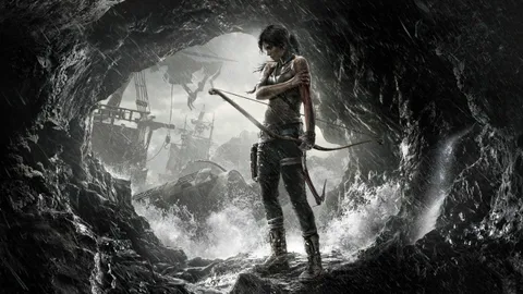 難破船が沈む洞窟の中で、泥にまみれた弓を構えるララ・クロフト。Tomb Raider のキービジュアル